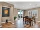 Dining room featuring wood floors, a patio, and a wooden dining table set with seating for six at 7029 Bocaire Dr, Las Vegas, NV 89131