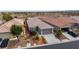 Well-maintained single-story home with desert landscaping and a two-car garage at 7029 Bocaire Dr, Las Vegas, NV 89131