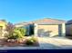 Charming single-story home featuring a two-car garage and desert landscaping at 7029 Bocaire Dr, Las Vegas, NV 89131