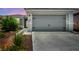 Inviting home exterior with a well-maintained two-car garage, charming curb appeal at 7029 Bocaire Dr, Las Vegas, NV 89131