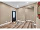 Inviting home foyer with wood-look floors and an accent rug at 7029 Bocaire Dr, Las Vegas, NV 89131