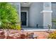 Close-up of the home's front door and desert landscaping at 7029 Bocaire Dr, Las Vegas, NV 89131