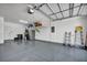 Spacious three car garage with epoxy floors, storage, and ample space at 7029 Bocaire Dr, Las Vegas, NV 89131