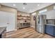 Spacious kitchen featuring stainless steel refrigerator and appliances, wood floors, and open pantry shelving at 7029 Bocaire Dr, Las Vegas, NV 89131