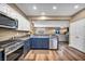 Charming kitchen showcasing stainless steel appliances, wood floors, and an open concept layout at 7029 Bocaire Dr, Las Vegas, NV 89131