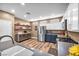 Charming kitchen featuring stainless steel appliances, wood floors, open shelving and ample counter space at 7029 Bocaire Dr, Las Vegas, NV 89131
