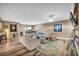 Spacious living room with modern decor, lots of natural light, and wood-look floors at 7029 Bocaire Dr, Las Vegas, NV 89131
