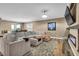 Bright living room featuring an electric fireplace and comfortable furniture at 7029 Bocaire Dr, Las Vegas, NV 89131