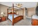 Comfortable main bedroom features a ceiling fan and dressers at 7029 Bocaire Dr, Las Vegas, NV 89131