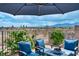 Inviting patio featuring comfortable seating around a fire pit with beautiful desert views at 7029 Bocaire Dr, Las Vegas, NV 89131