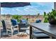 Relaxing outdoor area offering comfortable seating and dining options with a beautiful desert view at 7029 Bocaire Dr, Las Vegas, NV 89131