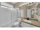 Cozy bathroom featuring a vanity, mirror, and shower with a tub at 7813 Riviera Beach Dr, Las Vegas, NV 89128