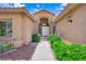 Inviting home entrance framed by lush landscaping at 7813 Riviera Beach Dr, Las Vegas, NV 89128