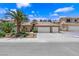 Charming single-story home featuring a three-car garage and desert landscaping at 7813 Riviera Beach Dr, Las Vegas, NV 89128