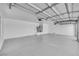 Spacious garage features bright lighting and plenty of room for vehicles and storage at 7813 Riviera Beach Dr, Las Vegas, NV 89128