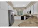 Bright kitchen features stainless steel appliances, granite counters, and abundant storage at 7813 Riviera Beach Dr, Las Vegas, NV 89128