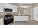 Kitchen boasts granite countertops, stainless steel appliances, and an open layout at 7813 Riviera Beach Dr, Las Vegas, NV 89128