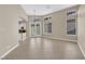 Open living room featuring tile floors and sliding glass doors to backyard at 7813 Riviera Beach Dr, Las Vegas, NV 89128
