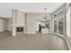 Open living room with tile floors, fireplace, and natural light at 7813 Riviera Beach Dr, Las Vegas, NV 89128
