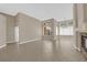 Open living room featuring tile floors, a fireplace, and large windows at 7813 Riviera Beach Dr, Las Vegas, NV 89128