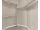 An organized walk-in closet with shelving and rods, offering plenty of storage space at 7813 Riviera Beach Dr, Las Vegas, NV 89128