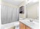 Bathroom features a sink, a toilet, a bathtub/shower with a cabinet above the toilet at 7868 Territorial St, Las Vegas, NV 89149