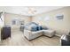 Inviting bedroom with large windows, ceiling fan, and comfortable seating at 7868 Territorial St, Las Vegas, NV 89149