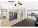 Bright and airy living area leading to the kitchen, bar, and stairs at 7868 Territorial St, Las Vegas, NV 89149