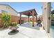 Relaxing outdoor space featuring a pergola, fire pit, grill, and ample seating perfect for entertaining at 7868 Territorial St, Las Vegas, NV 89149