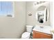Charming powder room with stylish decor and neutral color palette at 7868 Territorial St, Las Vegas, NV 89149