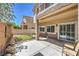 Home's outdoor space includes a covered patio and putting green at 8775 Traveling Breeze Ave # 102, Las Vegas, NV 89178