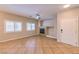 Bright living room with tiled floors, large windows, a fireplace, and neutral walls at 8775 Traveling Breeze Ave # 102, Las Vegas, NV 89178