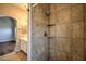 Tiled shower with built-in shelves, showcasing modern bathroom design at 8775 Traveling Breeze Ave # 102, Las Vegas, NV 89178