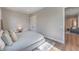 View of bedroom with wood floors and neutral tones, showing doorway to the living room at 9 Rue Grimaldi Way, Henderson, NV 89011