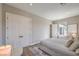 Cozy bedroom with double door closet, ensuite access, and neutral color palette at 9 Rue Grimaldi Way, Henderson, NV 89011