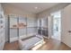 Spacious closet featuring custom shelving, drawers and a padded bench seat at 9 Rue Grimaldi Way, Henderson, NV 89011