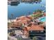 Beautiful clubhouse with red tile roof, resort-style pool, and palm trees, providing a luxurious and relaxing environment at 9 Rue Grimaldi Way, Henderson, NV 89011