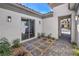 Charming courtyard with stone pathway, plants, and exterior lighting at 9 Rue Grimaldi Way, Henderson, NV 89011