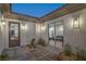 Private courtyard featuring a stone walkway, desert landscaping, and seamless indoor-outdoor living at 9 Rue Grimaldi Way, Henderson, NV 89011