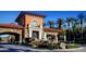 Elegant gated entrance with stone archway, fountain, and lush landscaping, offering a welcoming and secure entry at 9 Rue Grimaldi Way, Henderson, NV 89011