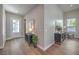 Inviting entryway with wood-look floors, contemporary furnishings, and abundant natural light at 9 Rue Grimaldi Way, Henderson, NV 89011