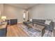 A cozy and well-lit living area featuring a comfortable sofa, coffee table, and sleek bar at 9 Rue Grimaldi Way, Henderson, NV 89011