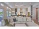 Open-concept living area showcasing a seamless transition to the kitchen, dining, and outdoor spaces at 9 Rue Grimaldi Way, Henderson, NV 89011