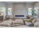 Comfortable living room featuring modern fireplace, plush seating, and serene neutral tones at 9 Rue Grimaldi Way, Henderson, NV 89011