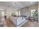 Spacious living room with modern fireplace, wood floors, and seamless flow to outdoor living space at 9 Rue Grimaldi Way, Henderson, NV 89011