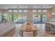 Open-concept living area with modern decor and sliding glass doors to the outdoor space at 9 Rue Grimaldi Way, Henderson, NV 89011