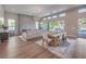 Spacious living area with wood floors, modern fireplace, and seamless transition to outdoor area at 9 Rue Grimaldi Way, Henderson, NV 89011