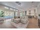 Bright living room with a view, wood floors, and seamless access to outdoor patio area at 9 Rue Grimaldi Way, Henderson, NV 89011
