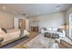 Bright main bedroom with comfortable seating area and ensuite bathroom at 9 Rue Grimaldi Way, Henderson, NV 89011