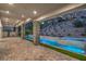 Covered patio with stone pillars that features a modern pool and spa at 9 Rue Grimaldi Way, Henderson, NV 89011